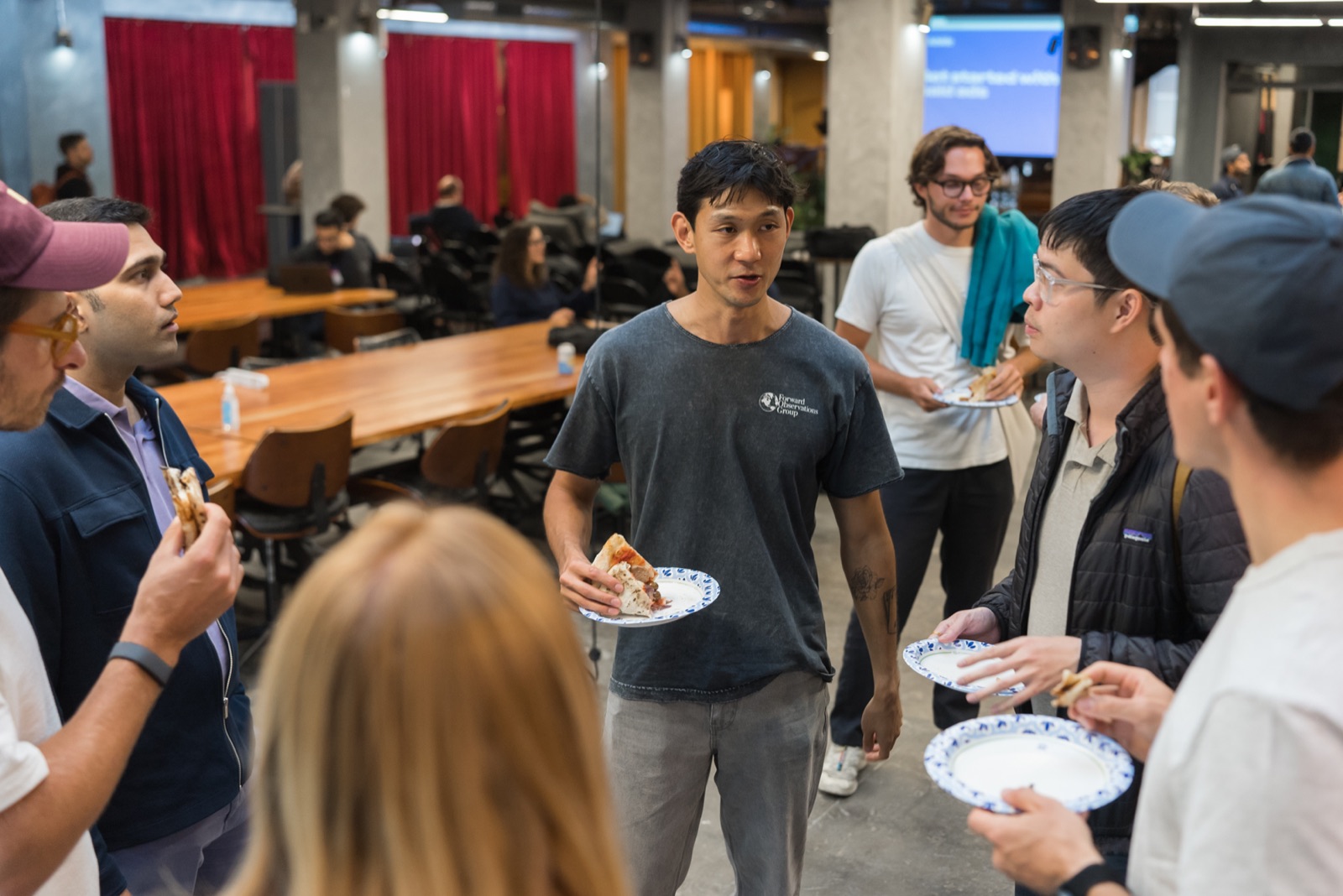Founders eating pizza and talking before the workshops